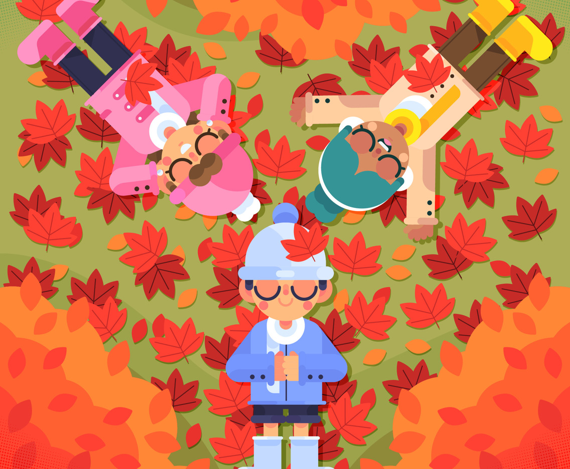 Children Lie On A Pile Of Fallen Leaves