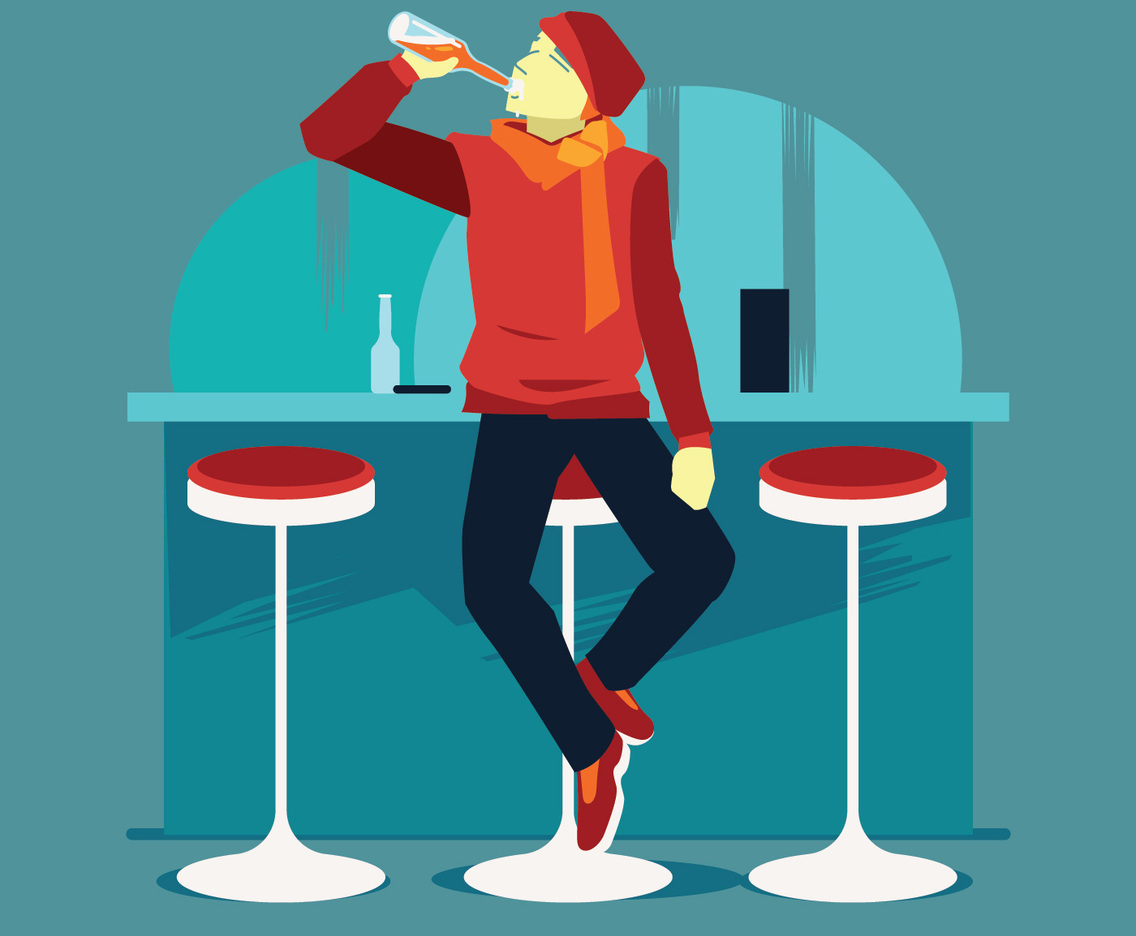 Happy Young Man Drinking Beer from Glass at Bar or Pub