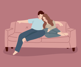 A Couple Cuddling In The Couch