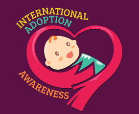 Hands Hug the Baby for International Adoption Awareness