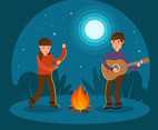Young Couple  Playing Guitar and Dancing at Campfire