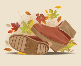 Close up view of stylish fall boots on dusty road