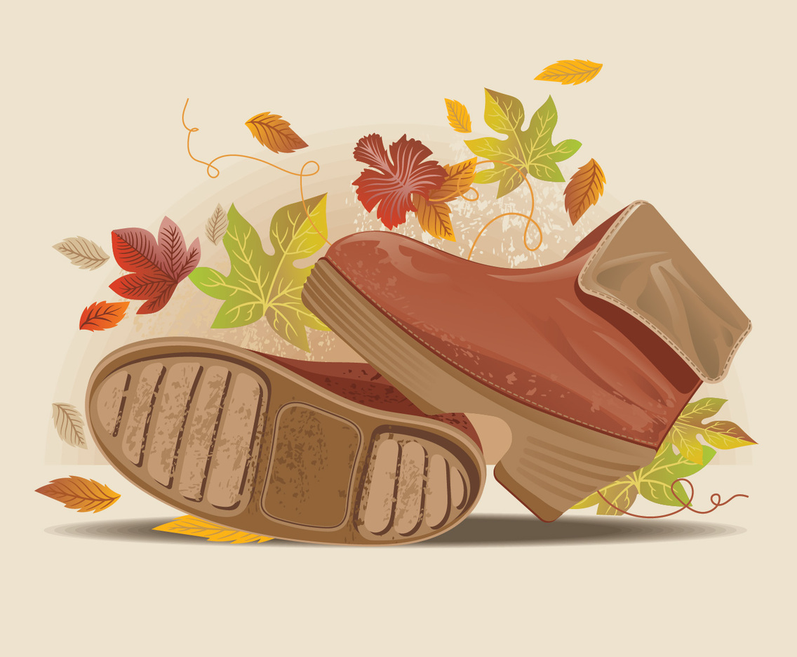 Close up view of stylish fall boots on dusty road