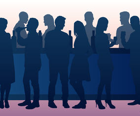 People Drinking In A Busy Bar